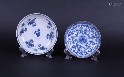 Two porcelain plates, both with floral decor and both with c...