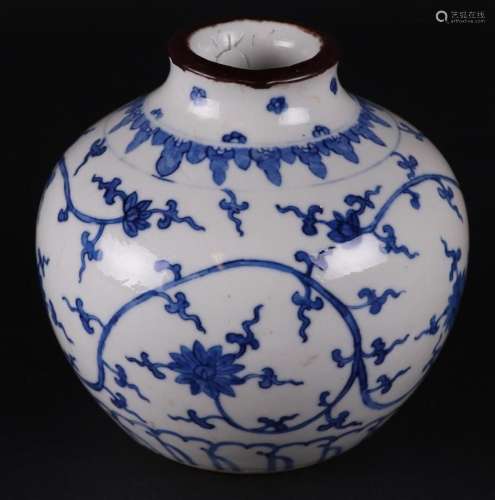 A porcelain vase with floral decor, marked Kangxi. China, 19...