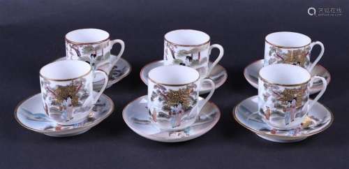 A set of six cups and saucers decorated with various figures...
