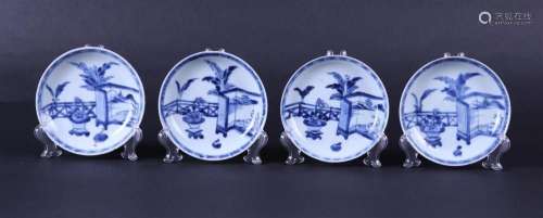 A set of four porcelain plates decorated with a folding scre...