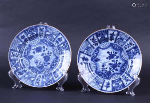 Two porcelain dishes with compartments on the rim, with amon...