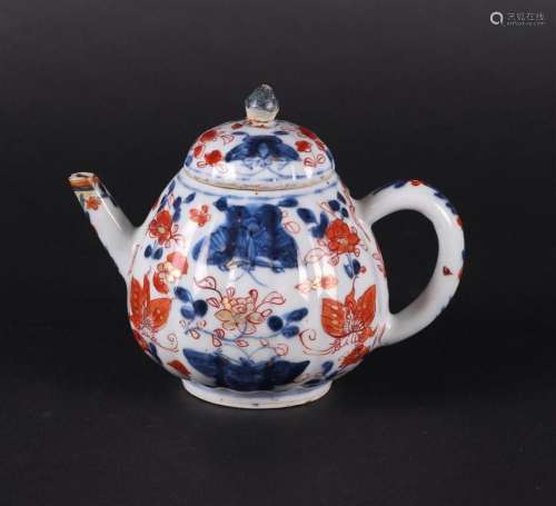 A porcelain Imari ribbed teapot with floral decor with a lar...