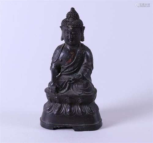 An early 17th century Chinese bronze seated Buddha.