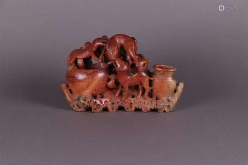 A soapstone sculpture decorated with mythical animals. China...