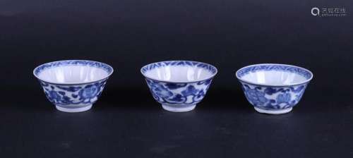 Three porcelain cups with honeycomb relief decor and rich lo...