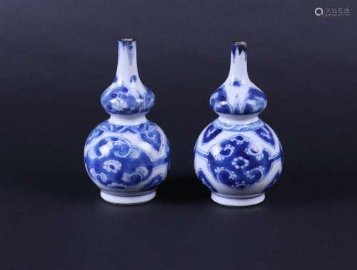 A set of porcelain nodule vases with floral decor in flower ...