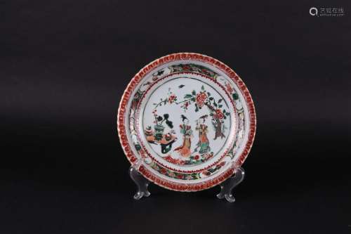 A porcelain plate Famille Verte with two long lines at the t...