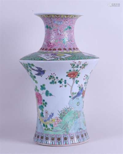 A porcelain Famile Rose vase decorated with various birds an...