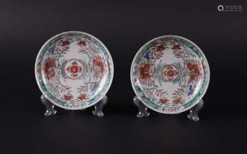Two porcelain Famille Verte plates with rich floral decorati...