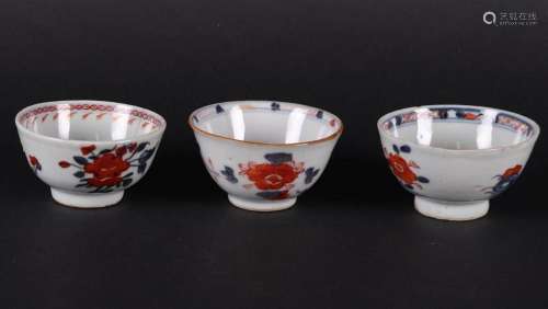 Three porcelain Imari bowls with floral decor, one with a sw...