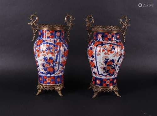 A set of two porcelain Imari vases with cast bronze mounts. ...