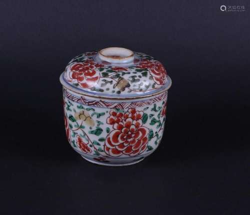 A porcelain Famille Verte lidded jar with flattened lid, and...