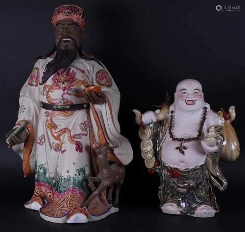 A lot of (2) pottery figures consisting of a sage and Buddha...