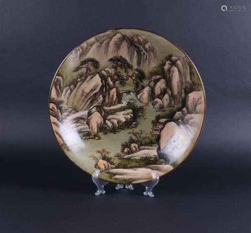 A large porcelain dish decorated with a Chinese Landscape. C...