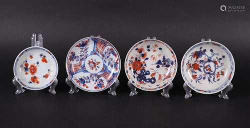 Four various porcelain Imari plates, one with a river landsc...