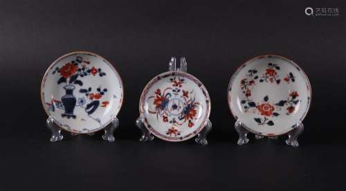 Three porcelain Imari plates, all with floral decor and capu...