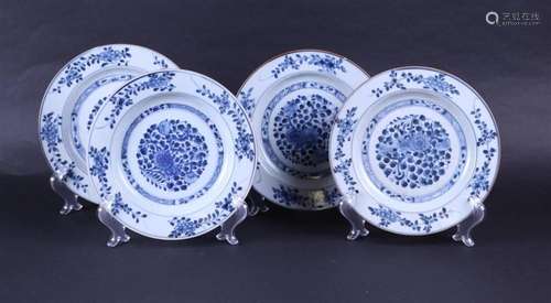 A set of four porcelain plates with a floral decor. China, 1...