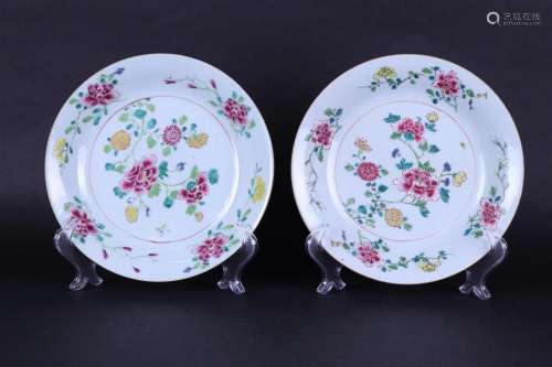 Two porcelain Famille Rose soup plates with rich floral deco...