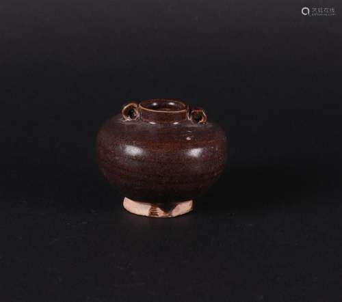 A brown stoneware storage jar with two looped ears. China ea...