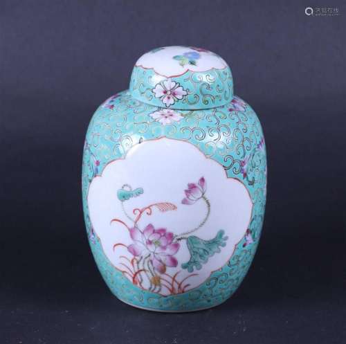A porcelain famile rose covered pot decorated with flowers i...