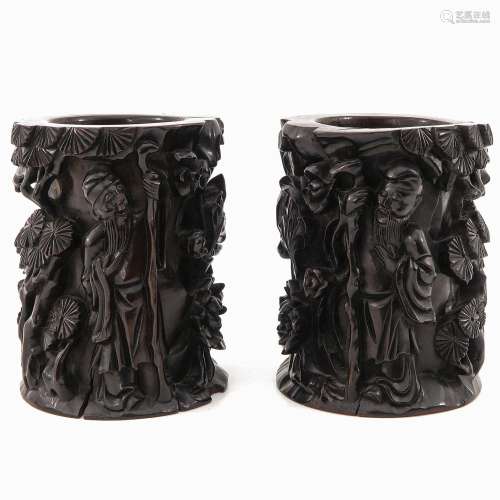 A Pair of Carved Wood Brush Pots