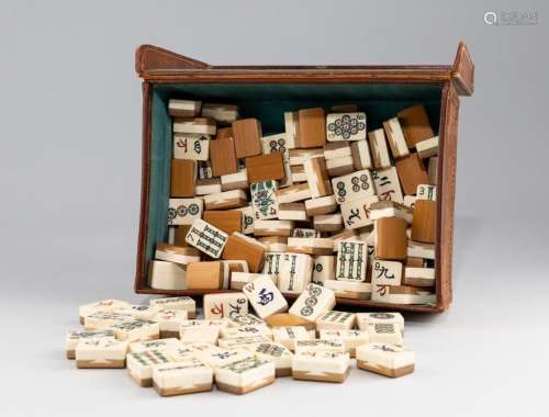 A leather cased mahjong set.