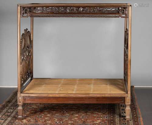 A Chinese hardwood four poster double bed
