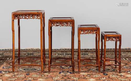 A Chinese hardwood nest of tables. Largest: 28 x 16 3/4 x 13...