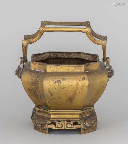 A Chinese brass twin handled incense burner. 4 1/2 in. (11.4...