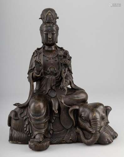 A Chinese bronze figure of Guanyin seated upon an elephant. ...