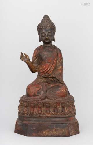 A gilt metal lacquered figure of Gautama Buddha. 9 in. (22.9...