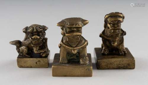 Three Chinese bronze foo dog stamps (3). 1 3/4 in. (4.4 cm.)...