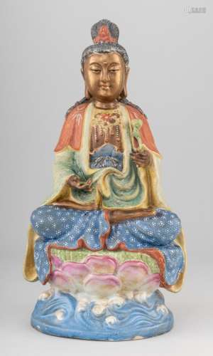 A polychrome porcelain decorated figure of Quanyin, 15 1/4 i...