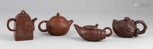 A group of four Chinese Yixing clay teapots. Tallest: 3 1/2 ...