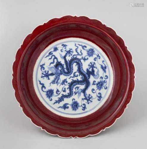 A Chinese red glazed lotus plate, 9 in. (22.9 cm.) d.