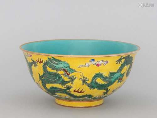A yellow ground famille rose dragon bowl, 6 1/2 in. (16.5 cm...