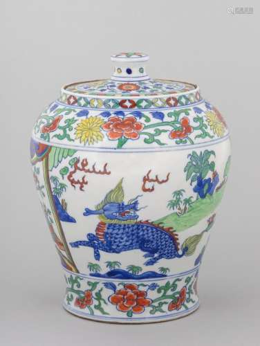 A Chinese wucai lidded jar with tapered body