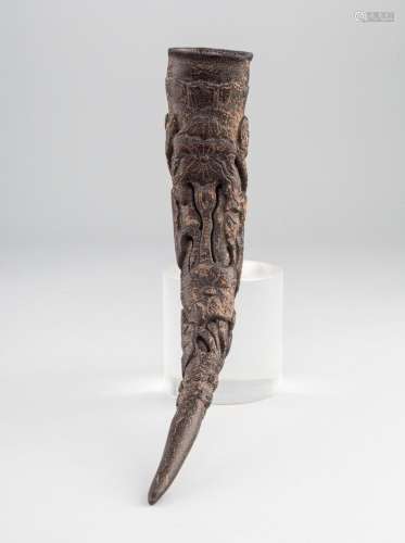 A Sino-Tibetan style carved horn cup. 11 in. (27.9 cm.) l.
