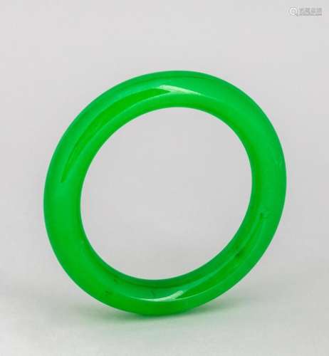 A spinach green jadeite lady\'s bangle. 2 1/2 in. (6.4 cm.) ...