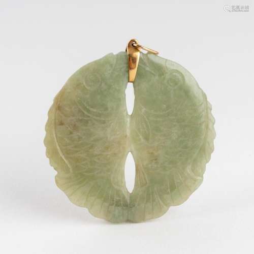 A carved Chinese circular jadeite pendant,
