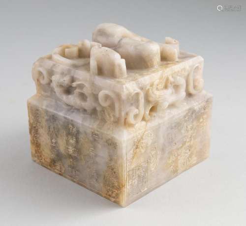 A Chinese grey and mottled jadeite seal, 3 1/2 x 3 3/4 x 3 3...