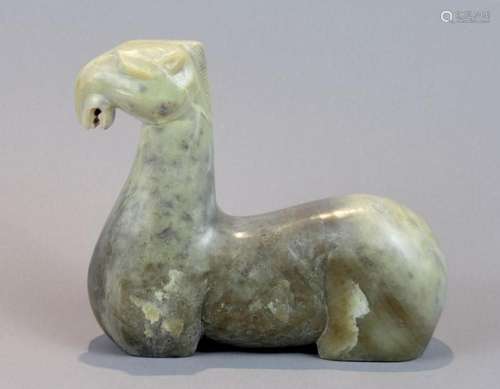 A Chinese greenish jadeite carved figure of a horse, 5 3/4 i...