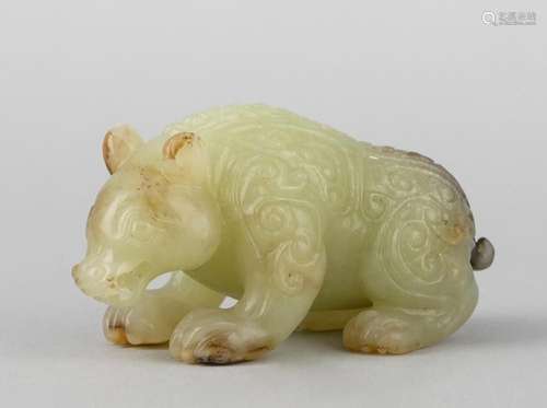 A Chinese celadon jadeite carving of a bear. 3 in. (7.6 cm.)...