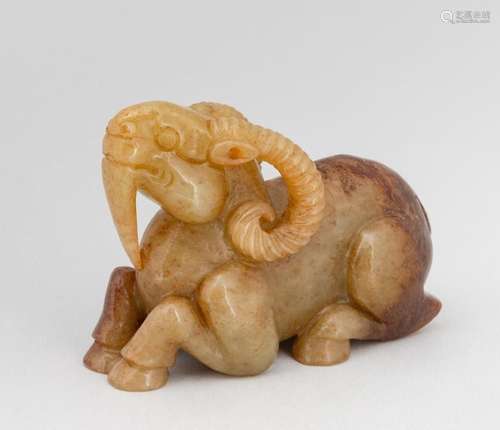 A mottled white jade goat figure. 2 1/4 in. (5.7 cm.) h.