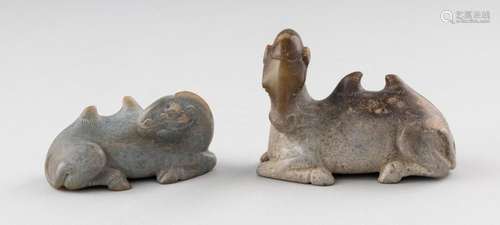 A pair of Chinese jadeite figures of recumbent camels. 3 1/4...