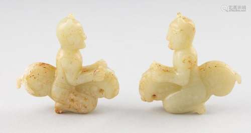 Two Chinese jadeite figures of riders on mythical beasts. (2...