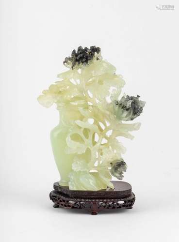 A Chinese jade carving of a flowering bush and lidded vase, ...