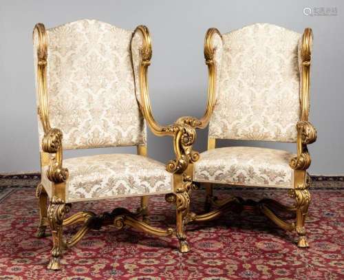 A pair of 19th century French gilded open armchairs.