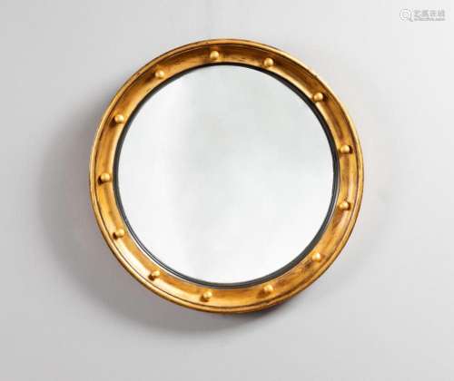 A Regency period round gilt wall hanging fish eye mirror, 21...