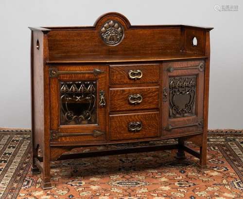 An oak Arts & Crafts sideboard of bowed outline, 55 x 22...